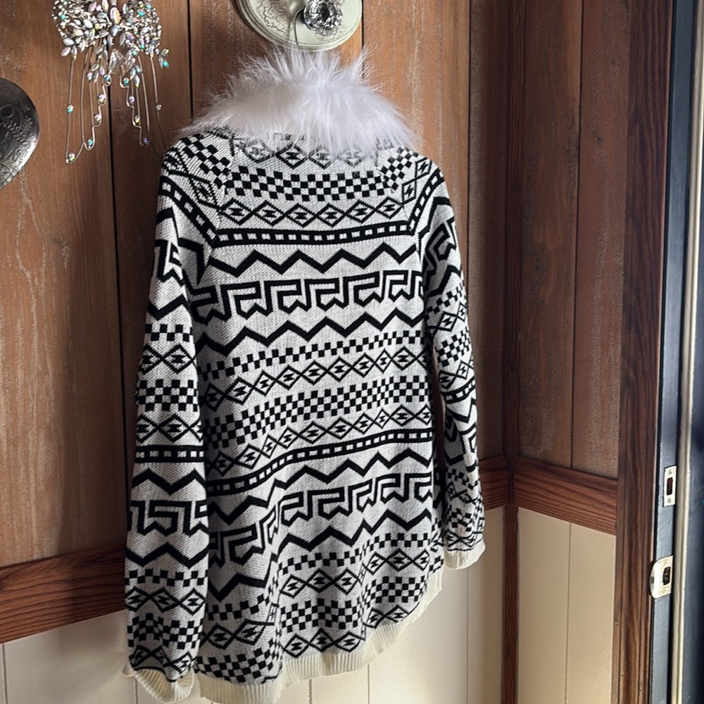 Winter black and white cardigan with fur trim.